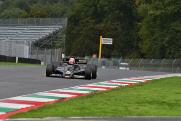 Fototapeta premium Scarperia, Italy - October 12th 2024: Lotus 78 of year 1977 ex Gunnar Nilsson and Mario Andretti drive by unknown in action during practice session at Mugello Circuit.