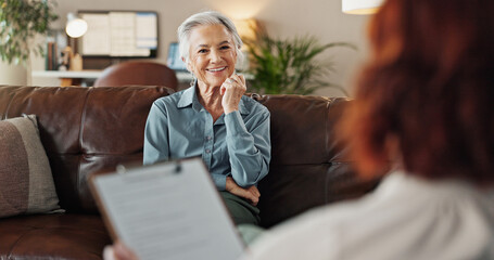 Psychologist, clipboard and senior woman with smile and office from mental health assessment in consultation. Help, support and care with counseling, psychology and evaluation with advice in office