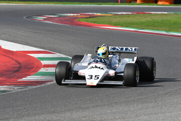 Fototapeta premium Scarperia, Italy - October 12th 2024: Osella FA1/B of year 1981 ex Jean Pierre Jarier drive by unknown in action during practice session at Mugello Circuit.