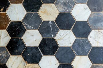 Hexagonal marble floor tiles in black, white, and brown hues creating a repeating geometric pattern