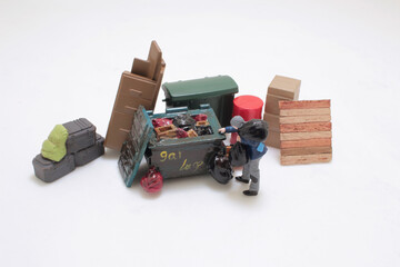 Miniature Figures Recycling and Collecting Cardboard Waste