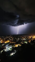 Fototapeta premium Lightning and rain storm with heavy rainfall and continuous lightning strikes lighting up the night