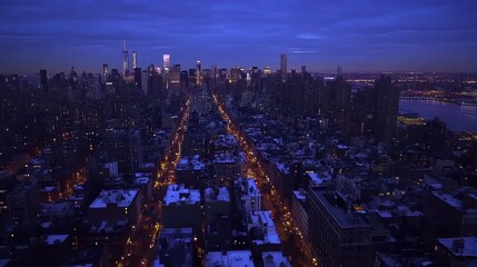 Obraz premium A panoramic view of a bustling city skyline at dusk, with lights beginning to twinkle.