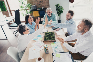 Photo high view of teamwork startup partners high five support comfortable nice creative startup...