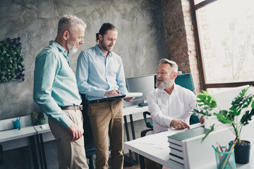 Photo of coworking project teamwork people men discuss work together conference meeting successful nice light office