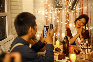 Friends Taking Picture Of Birthday Girl On Seventeenth Birthday Celebration