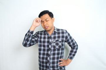 unhealthy asian man feel migraine and fatigue isolated on white wearing casual shirt