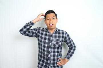 Fototapeta premium thoughtful asian man thinking idea with confused expression wearing casual shirt isolated on white