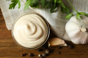 Bowl with mayonnaise and ingredients for cooking on the table 