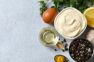 Bowl with mayonnaise and ingredients for cooking on the table 