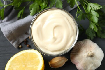 Bowl with mayonnaise and ingredients for cooking on the table 