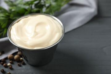 Bowl with mayonnaise and ingredients for cooking on the table 