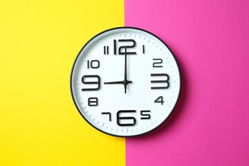 Big beautiful stylish clock on color background