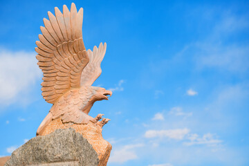 Sand stone sculpture of eagle flying