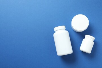 White bottles on color background 