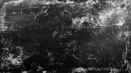 Black grunge scratched background with old film effect and dusty scary texture; space for text or design. Dark and scratched black grunge background, scratched black texture vintage film style.