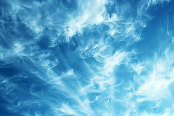 Obraz premium Wispy cirrus clouds stretching across a deep blue sky, creating delicate patterns.