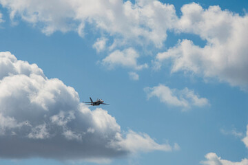 photographs of fighter jets, airplanes with power and elegance in the blue sky with white clouds
