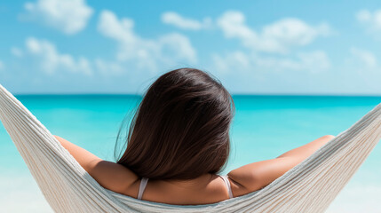 A piece of paradise with woman relaxing on hammock on the beach. Travel and vacation concept. Banner edition. 