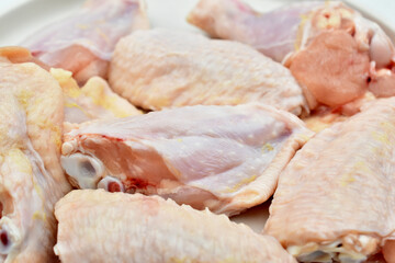 Close-up pieces of chicken meat ready for cooking.