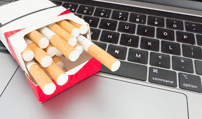 A cigarette and a laptop