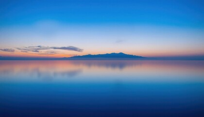 a view of a mountain in the distance with a blue sky