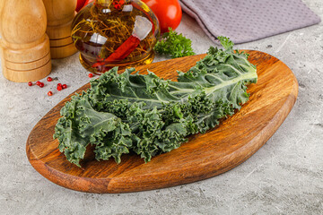 Green Kale cabbage leaves ocer board
