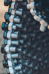 Metal steel gray bolts background. mixing connectors, interconnects. machinery