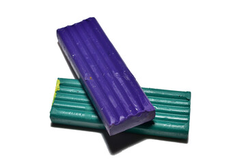 Plasticine for schoolchildren in two shades lies on a PNG background.