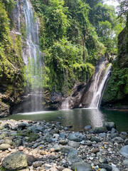 Fototapeta premium The beauty of Tebela Waterfall in Banyumas Regency, Central Java, indonesia. It was taken on November 18, 2024 by a professional. It's a wonderful waterfall with a nice view