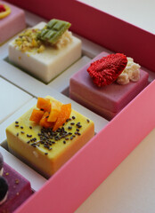  Collection Of Various Cakes in a Pink Cardboard Box. Assortment of Pieces Fruit Cakes. Box with Different Types of Sweets Stock Image