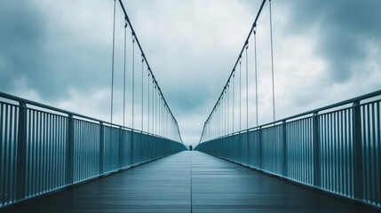 Perspective shot of a bridge deck against a cloudy sky, creating a feeling of openness and connection.