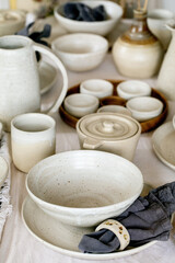 Rustic table setting with empty craft handmade ceramic tableware