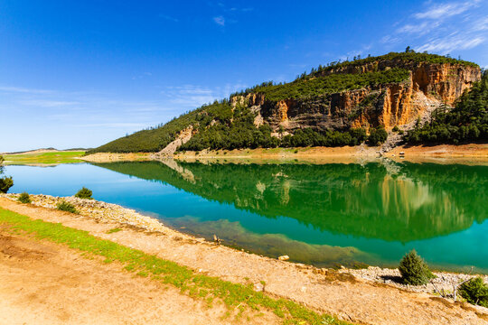The beautiful crystal clear Aguelmame Sidi Ali Lake. Khenifra National Park, Middle Atlas Mountains, Morocco