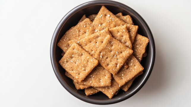 A bowl of whole wheat flatbread on a white background.