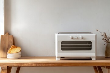 White toaster with toasted bread on kitchen counter. Minimalist kitchen appliance concept.