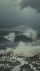 Stormy sea with large waves crashing on the shore. The sky is dark and cloudy, and the waves are white with foam