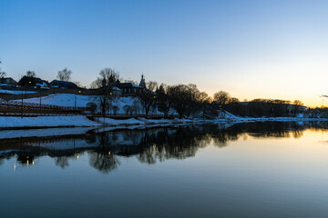 A beautiful lake with a snowy hill in the background