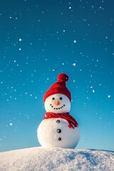 Obraz premium A cheerful snowman wearing a red hat and scarf stands proudly in a snowy field under a bright blue sky, creating a whimsical winter wonderland