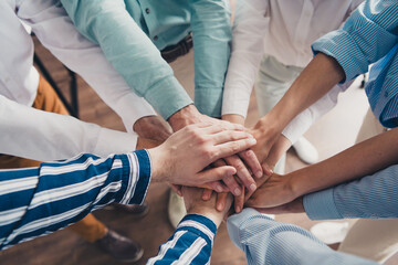 Cropped photo of coworking project teamwork people hold hands support work together conference meeting successful nice light office