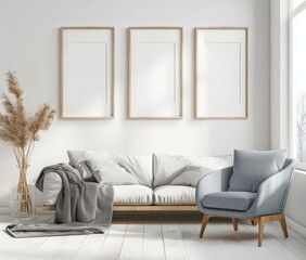 A minimalist living room with a white sofa, blue armchair, three empty frames, and a vase with dried grass