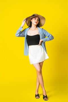 Elegant Fashion Concept Featuring Woman in Black Tank Top and White Skirt