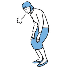 しんどそうにため息をつく若い女性