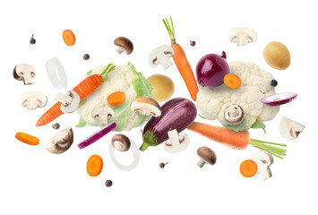 Many different fresh vegetables in air on white background
