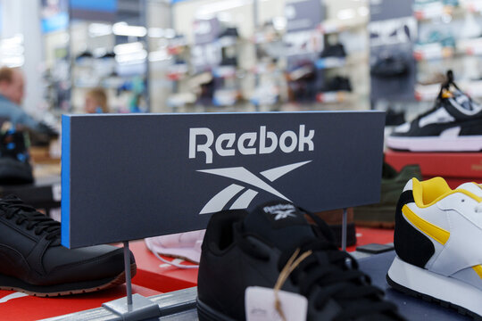 Tyumen, Russia-August 11, 2024: Display of athletic footwear Reebok at a retail store promoting sports gear in a bustling shopping environment