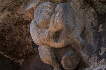 Romanesque carving man showing his sex, on Church of San Cipriano de Bolmir, Romanesque temple from the 12th century, Bolmir village, Campoo de Enmedio, Cantabria, Spain © Tolo