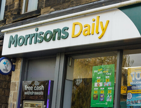 Sign and logo above entrance to Morrisons Daily the supermarket giant's neighbourhood convenience store selling good value  grocery and fresh produce 