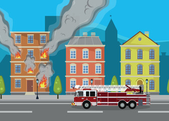 Fire in a city building. Fire truck near a burning house. Flames and smoke. Emergency situation.