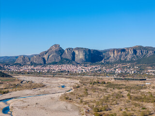 Aerial drone view of the Greek city named Kalampaka and the Meteora mountains.