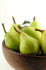six Pear Pyrus Commiunis in plate on white background